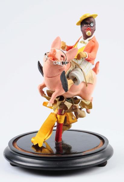 Appraisal: German Composition Man Riding Pig Candy Container Depicts African American