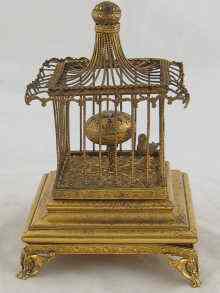 Appraisal: A brass table clock in the form of an oscillating