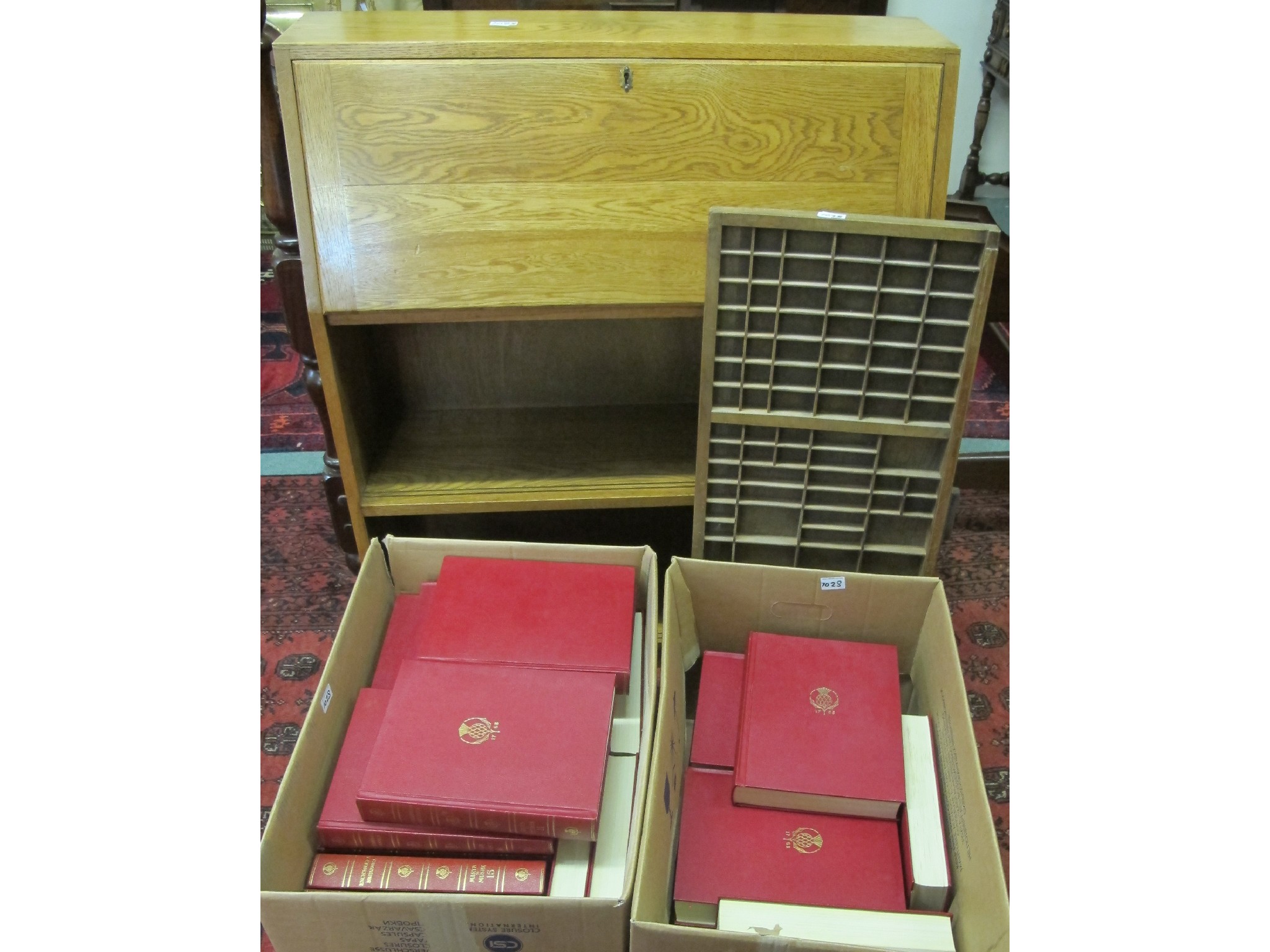 Appraisal: An oak bureau bookcase two boxes of Encyclopedia Britannica and