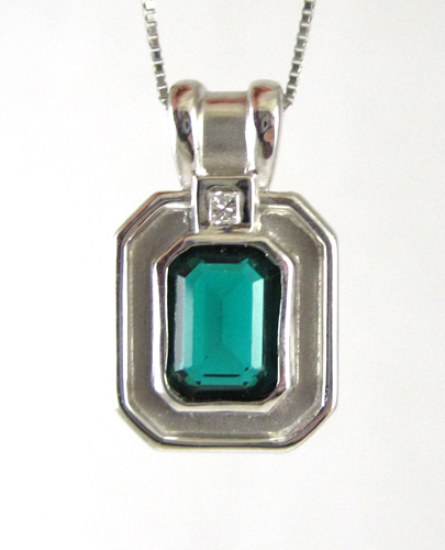 Appraisal: CHATHAM EMERALD AND DIAMOND PENDANT NECKLACE The k white gold