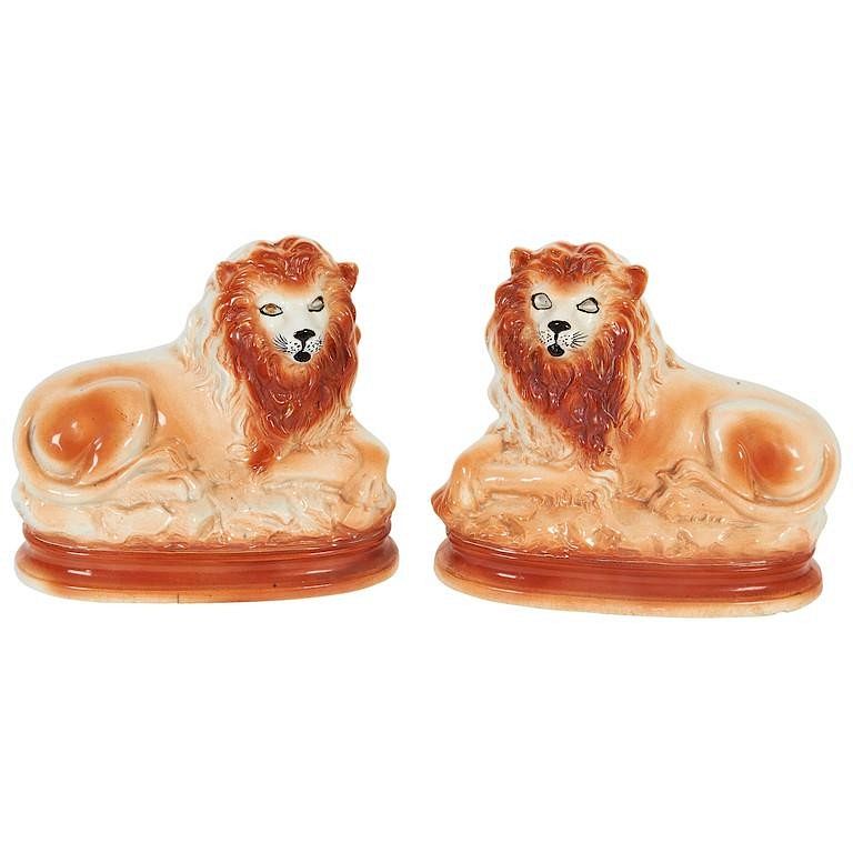 Appraisal: Staffordshire Ceramic Recumbent Lions Pair Staffordshire ceramic recumbent lions pair