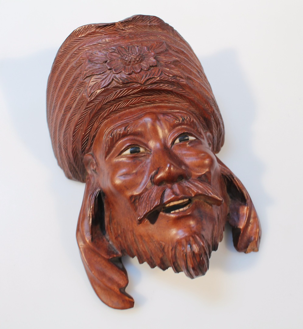 Appraisal: A thC Tibetan wooden face mask formed as a gentleman