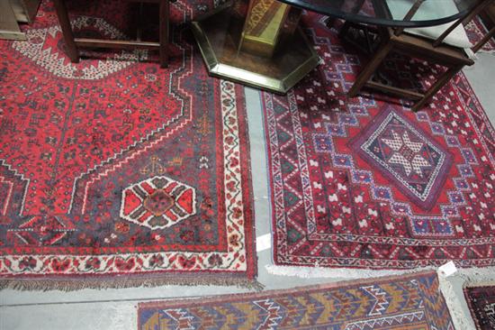 Appraisal: TWO ORIENTAL STYLE RUGS Both with red ground and geometric