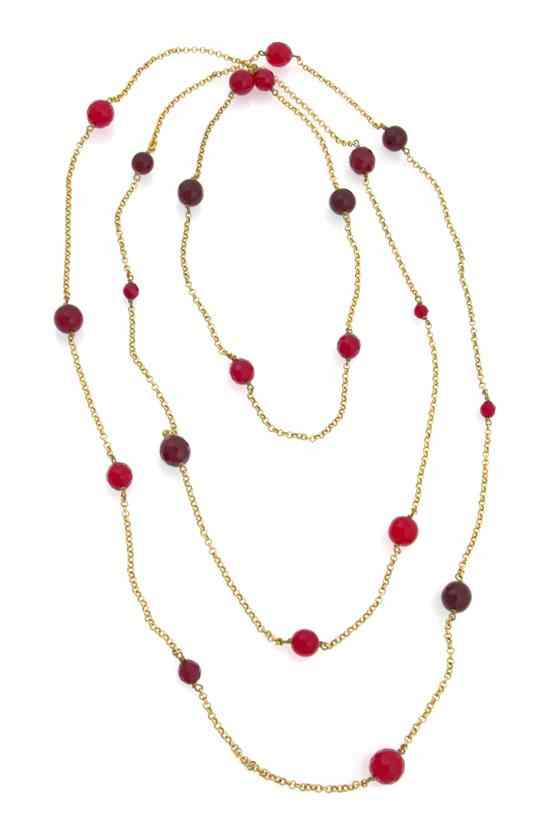 Appraisal: A Chanel Extra Long Goldtone and Bead Necklace with red