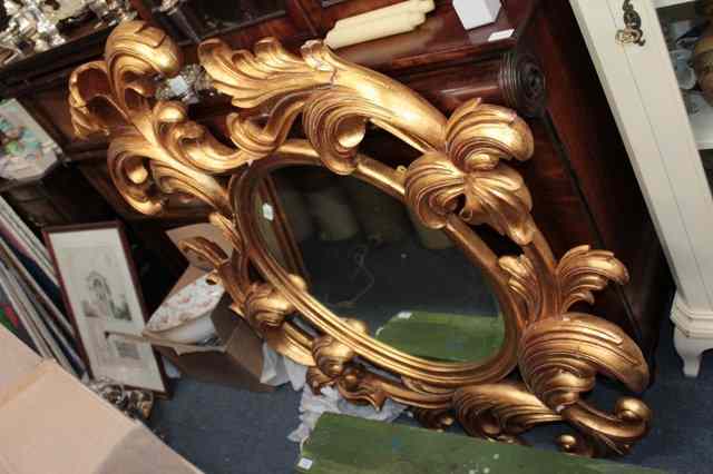 Appraisal: A PAIR OF DECORATIVE CARVED AND GILT PIER MIRRORS the