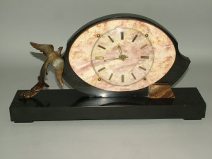 Appraisal: An Art Deco slate and marble clock of oval form