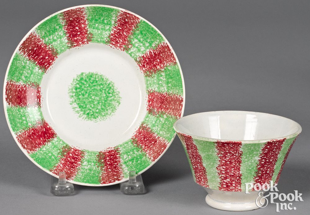 Appraisal: Green and red rainbow spatter cup and saucer Green and