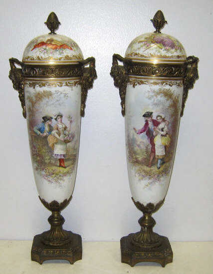 Appraisal: PAIR OF SEVRES STYLE PORCELAIN AND BRONZE URNS Each typical