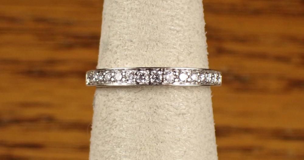 Appraisal: A DIAMOND ANNIVERSARY RING K white gold round-cut graduated diamonds