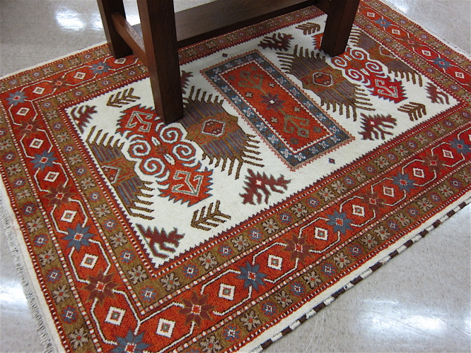 Appraisal: HAND KNOTTED ORIENTAL CARPET Indo-Serapi overall geometric pattern on cream