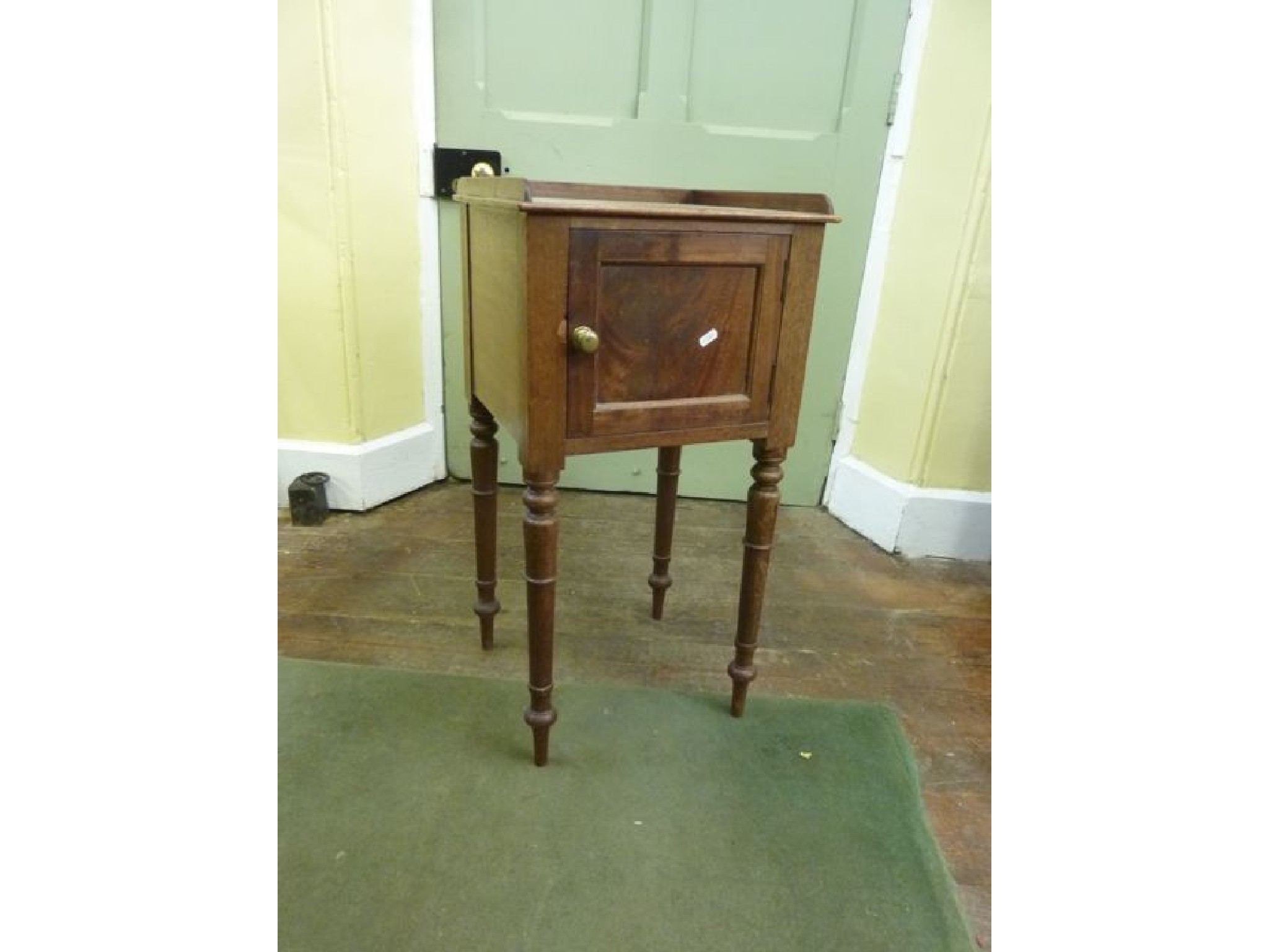 Appraisal: A mid th century mahogany pot cupboard panelled door on