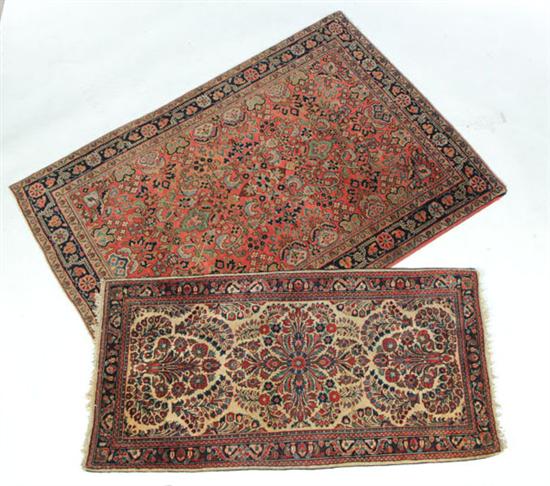 Appraisal: TWO ORIENTAL RUGS Twentieth century Sarouks One with salmon ground