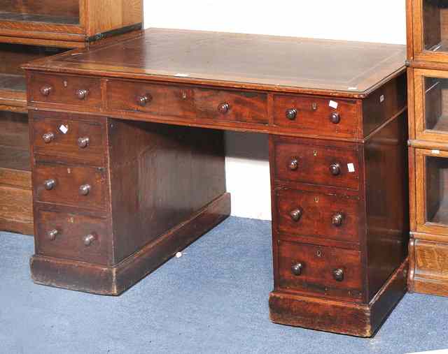 Appraisal: A VICTORIAN MAHOGANY PEDESTAL DESK with maroon leather inset top