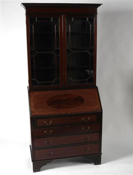 Appraisal: An Edwardian inlaid mahogany bureau bookcase the projected moulded cornice