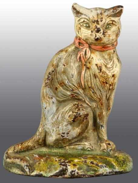 Appraisal: Cast Iron Sitting Cat Doorstop Description Marked Johnson Condition Good