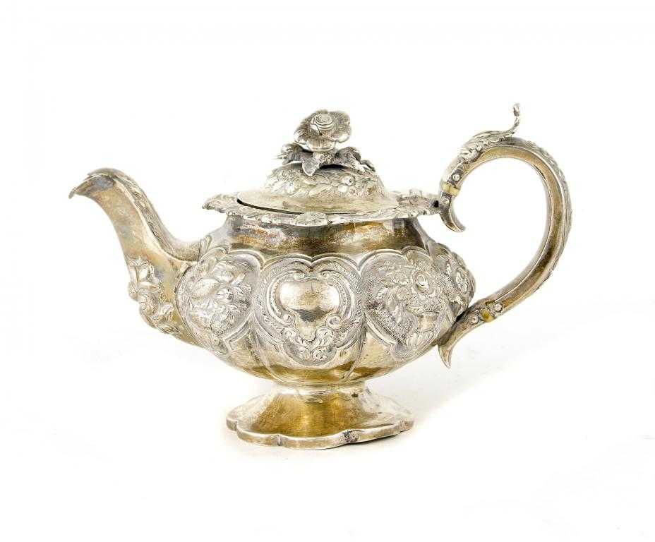 Appraisal: A VICTORIAN BACHELOR TEAPOT of melon type chased in high