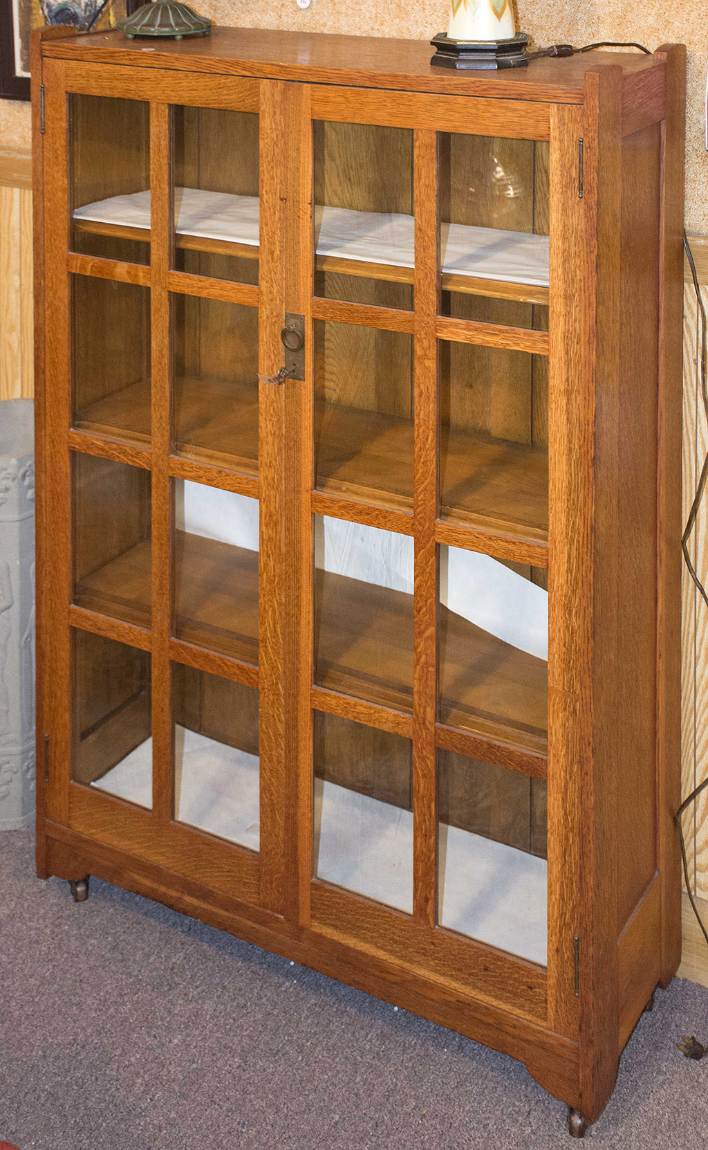 Appraisal: MISSION OAK BOOKCASE Circa - With two glazed doors containing