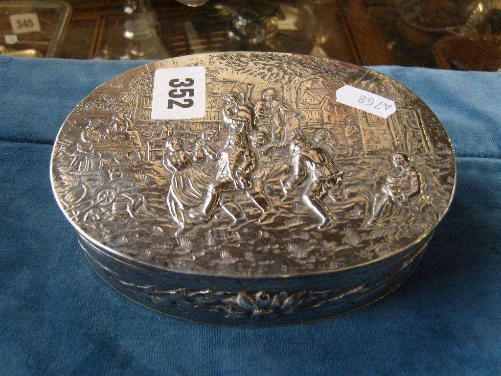 Appraisal: A continental white metal oval box with rising lid profuse