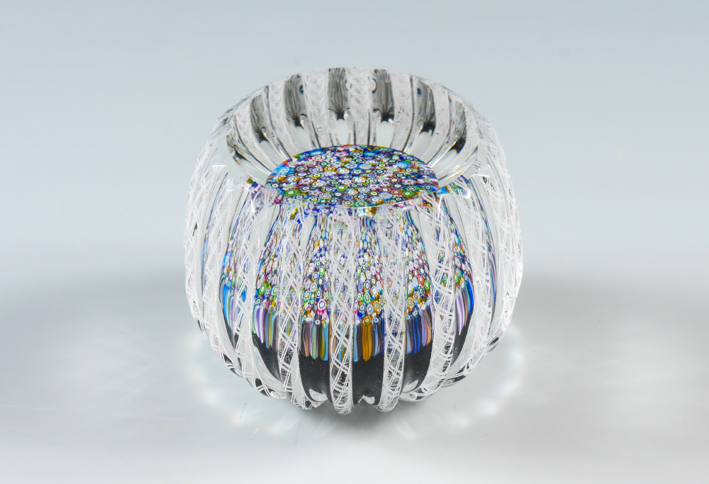 Appraisal: PERTHSHIRE MILLEFIORI LATTICINO PAPERWEIGHT Faceted close pack with radiating latticino