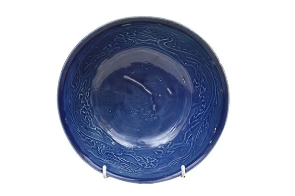 Appraisal: A CHINESE DEEP BLUE-GLAZED BOWL depicted with two dragons to