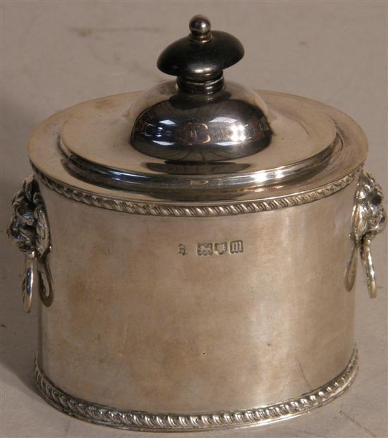 Appraisal: George V silver oval tea caddy with applied lion's head