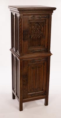 Appraisal: A Gothic style cupboard with linenfold panels and Gothic door