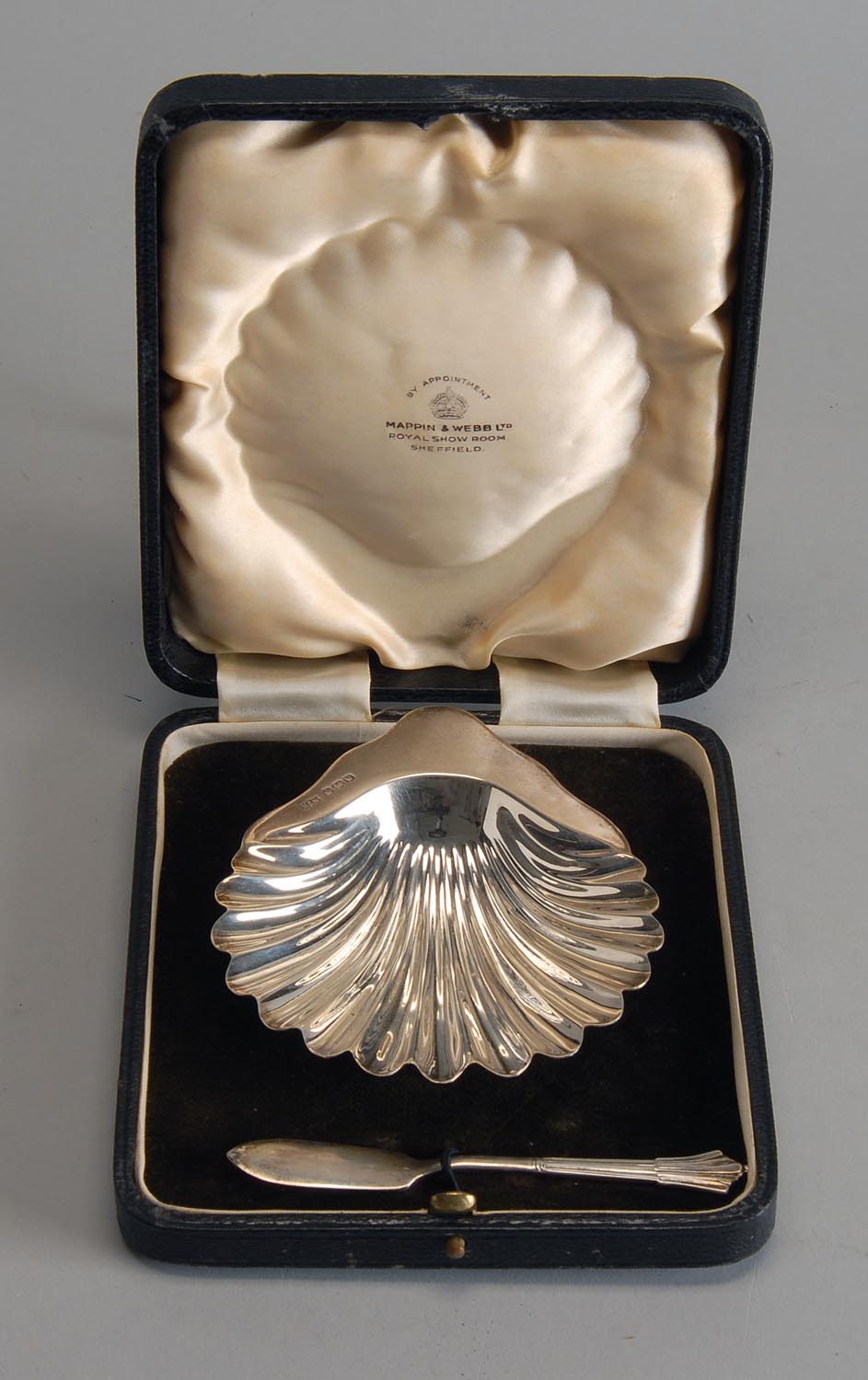 Appraisal: CASED ENGLISH SILVER SCALLOP-FORM BUTTER DISH AND SPREADER Sheffield Butter