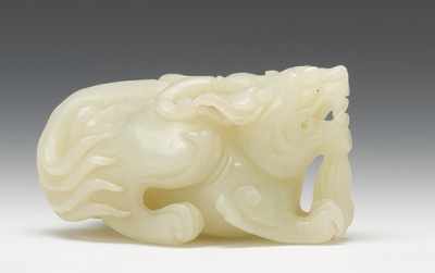 Appraisal: Carved Jade Recumbent Dragon A beautifully carved light green dragon