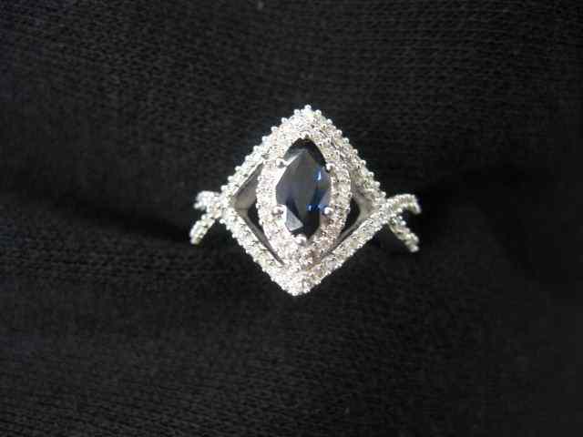 Appraisal: Blue Sapphire Diamond Ring marquise gem weighing carat with diamonds