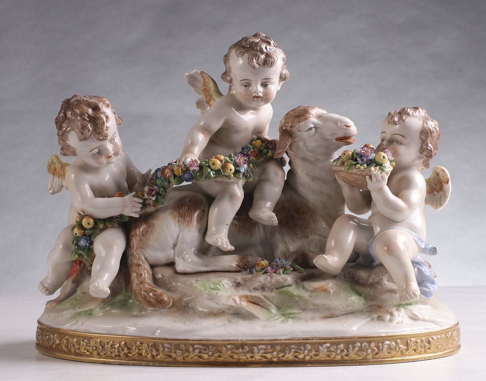 Appraisal: A CONTINENTAL PORCELAIN PUTTI AND LAMB GROUPING C Three seated