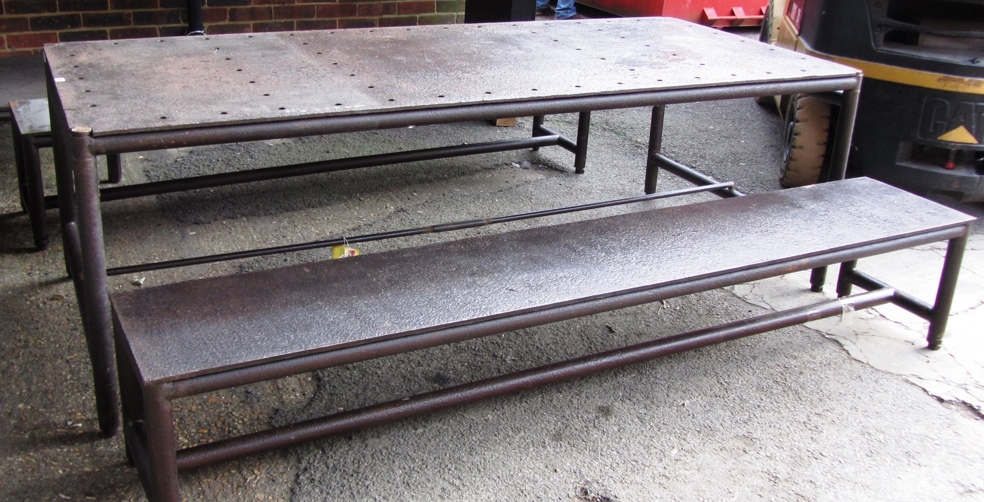 Appraisal: An industrial style steel rectangular table on turned supports cm