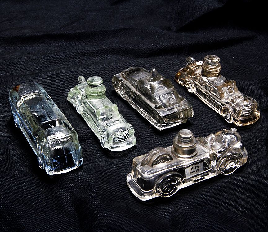 Appraisal: Assorted Vehicle Candy Containers Five various containers with no closures