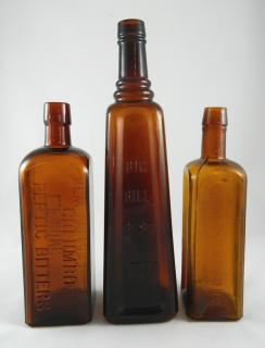 Appraisal: amber bitters bottles Bitters- amber- square marked horizontally on two