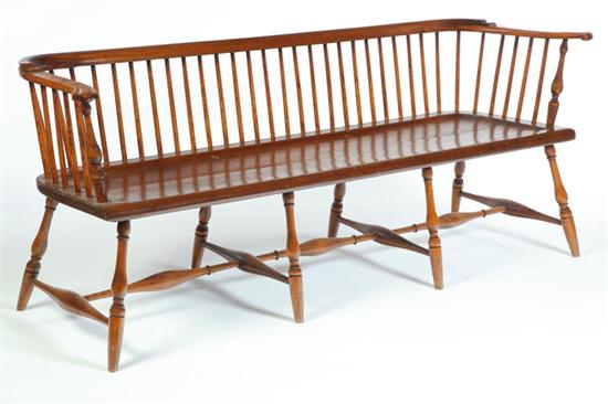 Appraisal: WINDSOR LOWBACK SETTLE BENCH American th century mixed woods Shaped