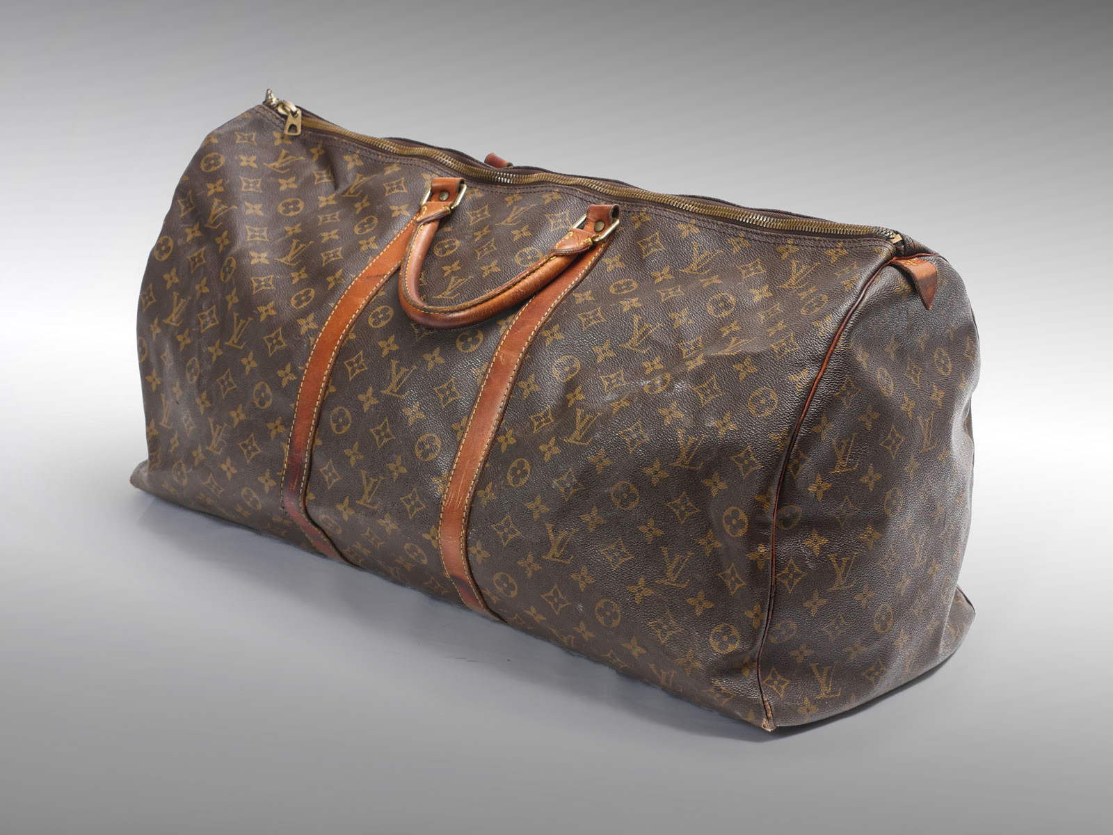 Appraisal: LOUIS VUITTON CARRY-ON BAG This stylish duffel is crafted of