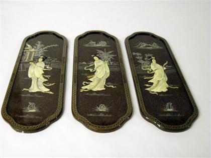 Appraisal: Four Chinese brown ground and applied panelsTall oval panels depicting