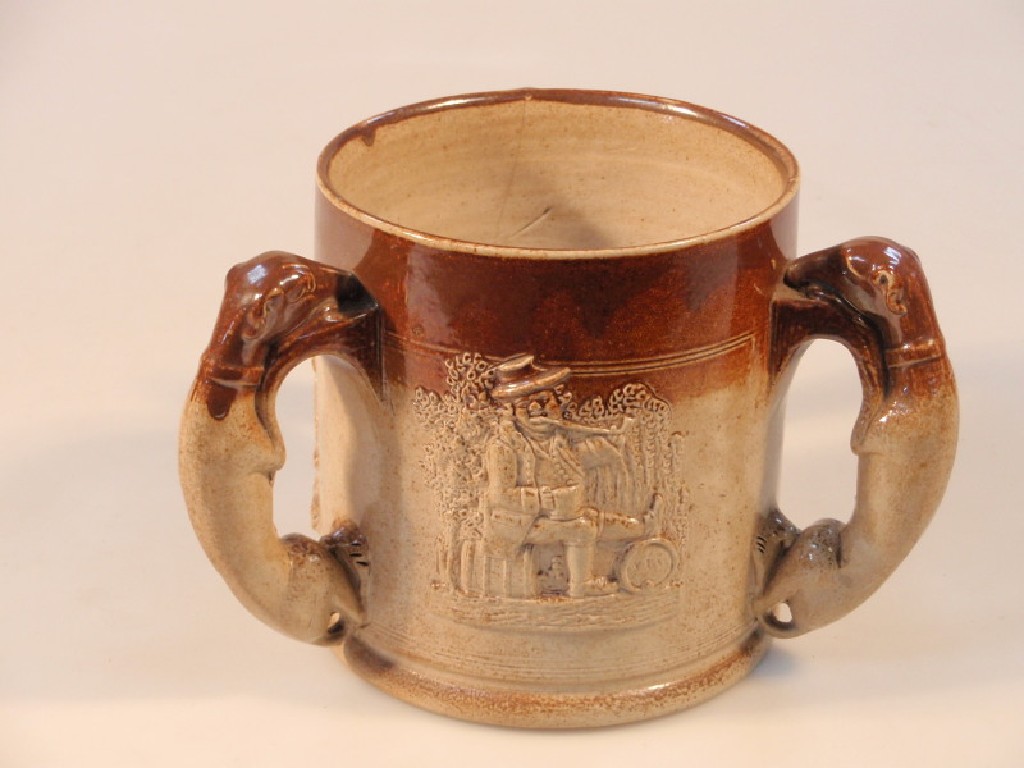 Appraisal: A late thC stoneware Tyg with three hound handles sprigged