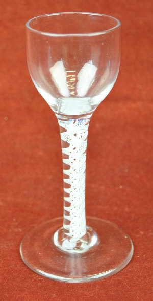 Appraisal: A Georgian cordial glass with plain ovoid bowl an opaque