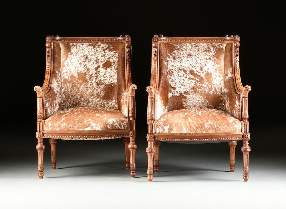 Appraisal: A PAIR OF LOUIS XVI REVIVAL COWHIDE UPHOLSTERED WALNUT BERG