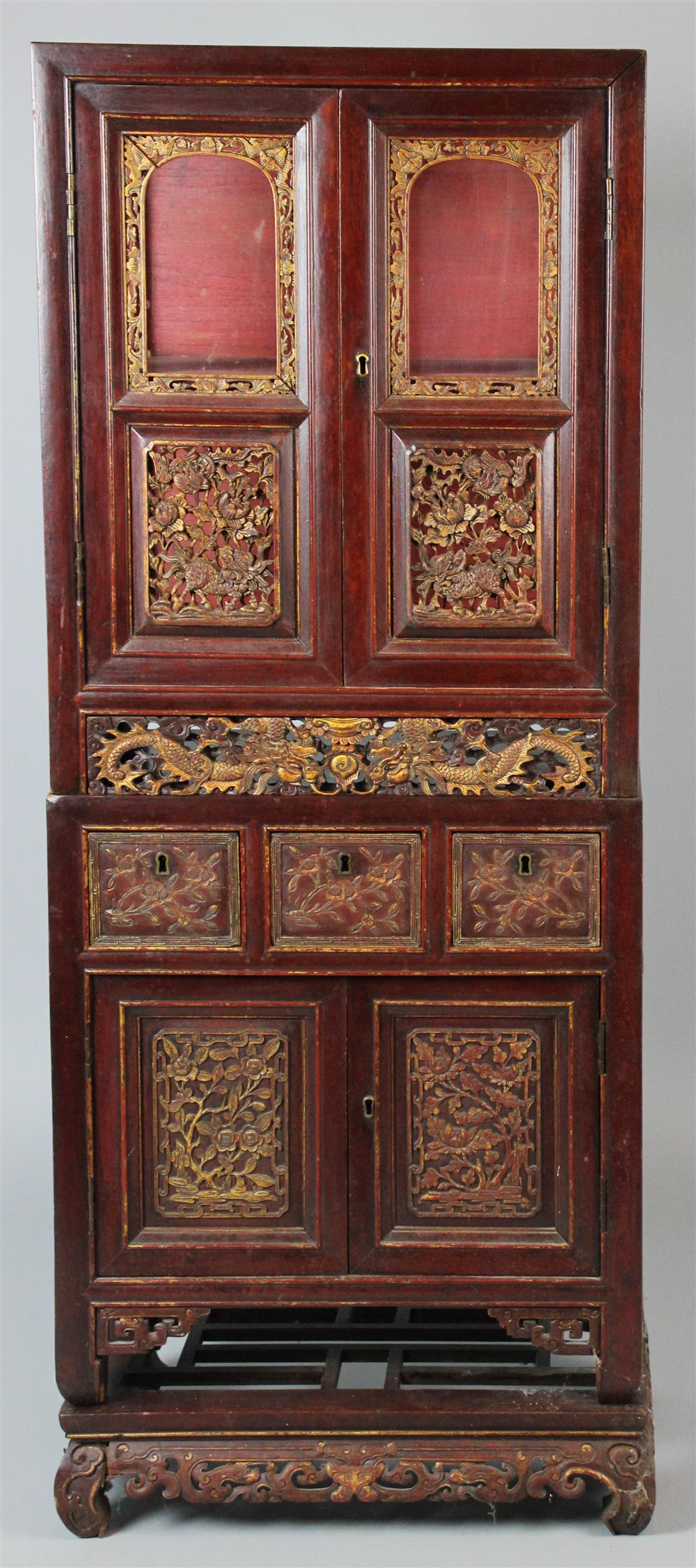 Appraisal: INDONESIAN CARVED VITRINE WITH TWO GLASS DOORS the cabinet of