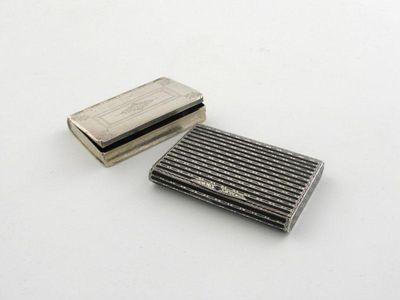 Appraisal: A silver and black enamel cigarette case of rectangular form