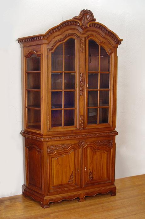 Appraisal: CONTEMPORARY PIECE CHINA CABINET Architecturally detailed with carved leaf design