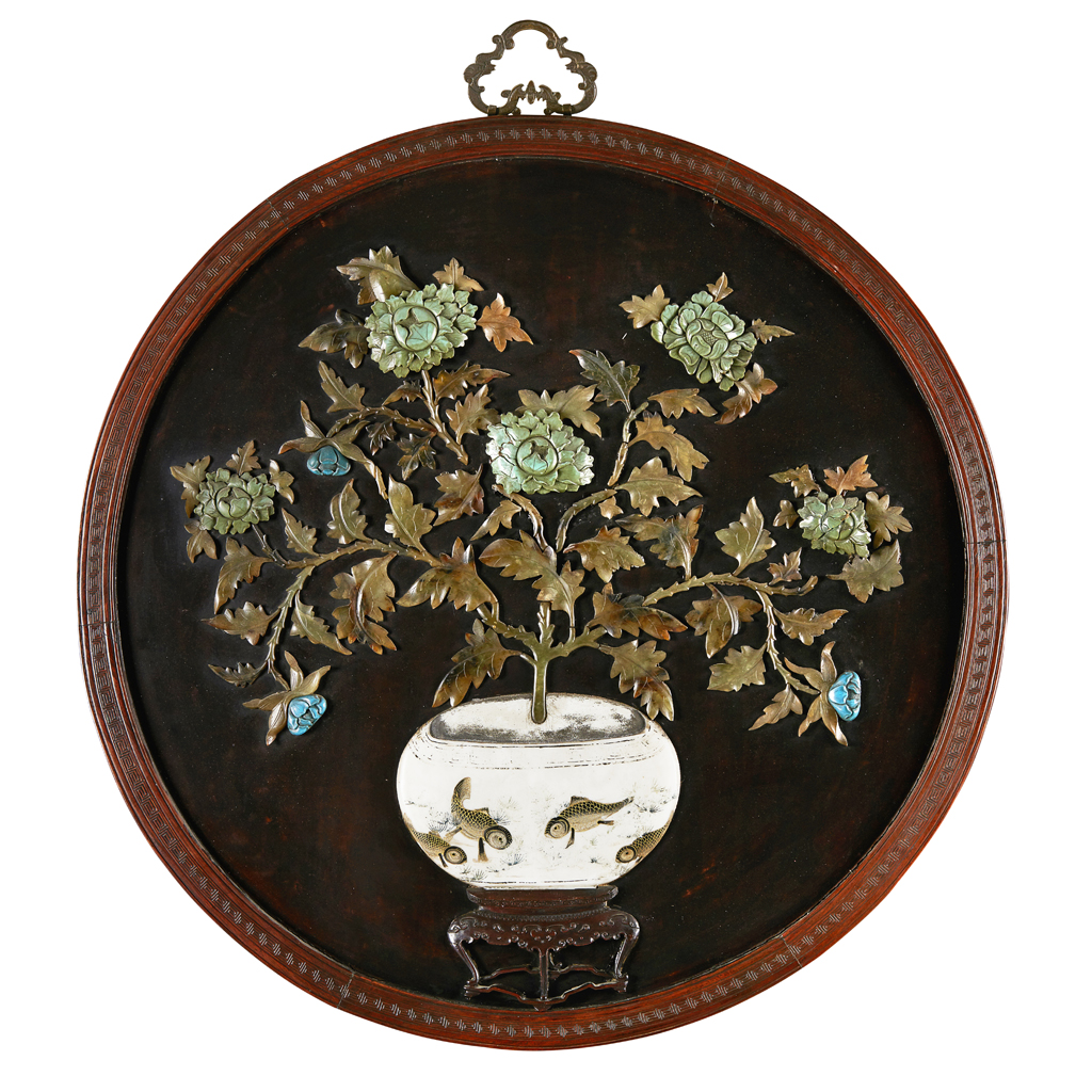 Appraisal: HARDSTONE INLAID CIRCULAR PANEL set in a carved wooden frame