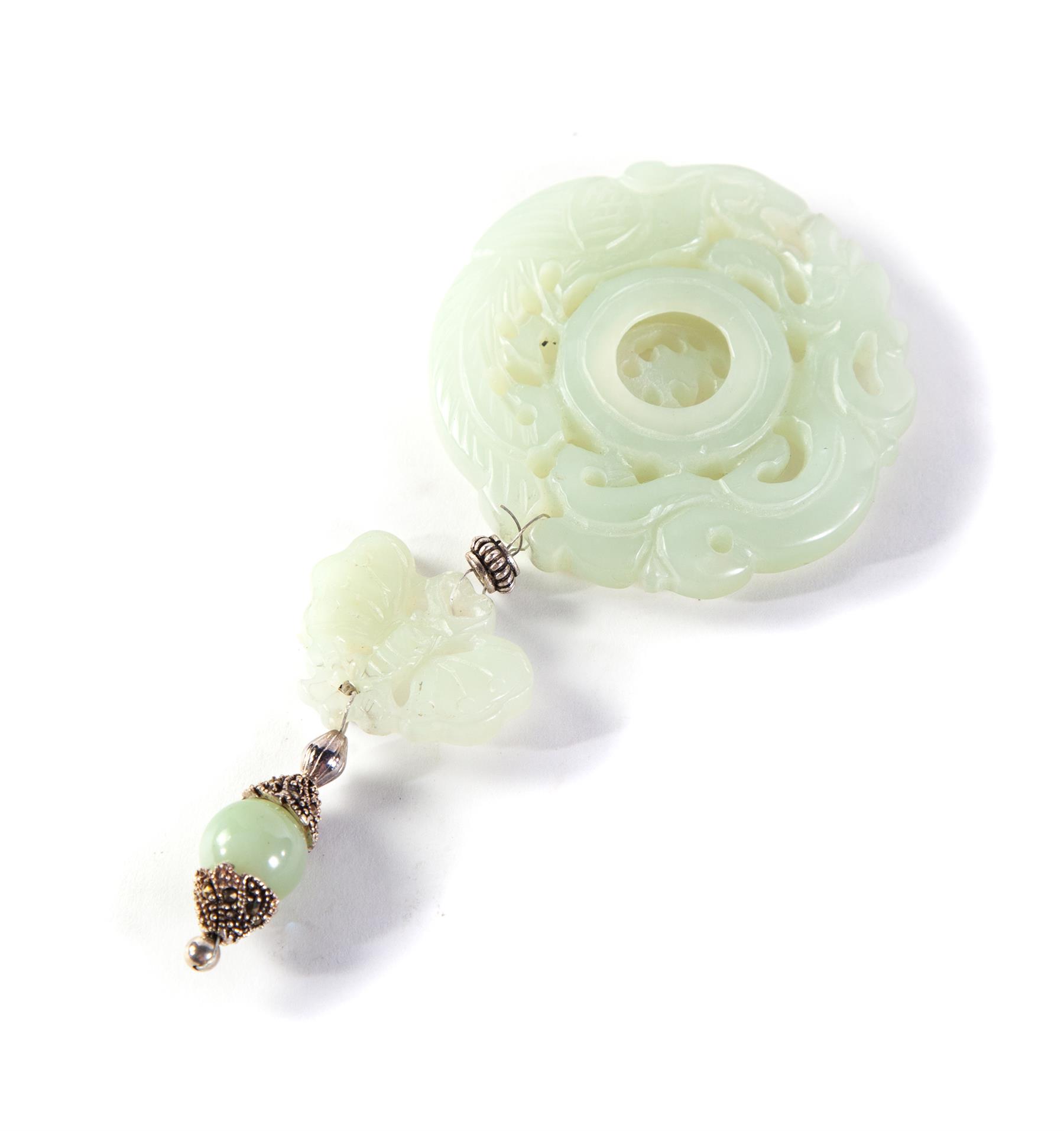 Appraisal: CHINESE JADE PENDANT Twentieth century Pale green with pierce carved