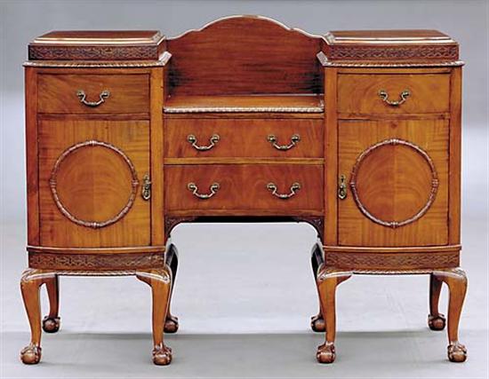 Appraisal: Georgian style carved mahogany pedestal sideboard bow front pedestals with