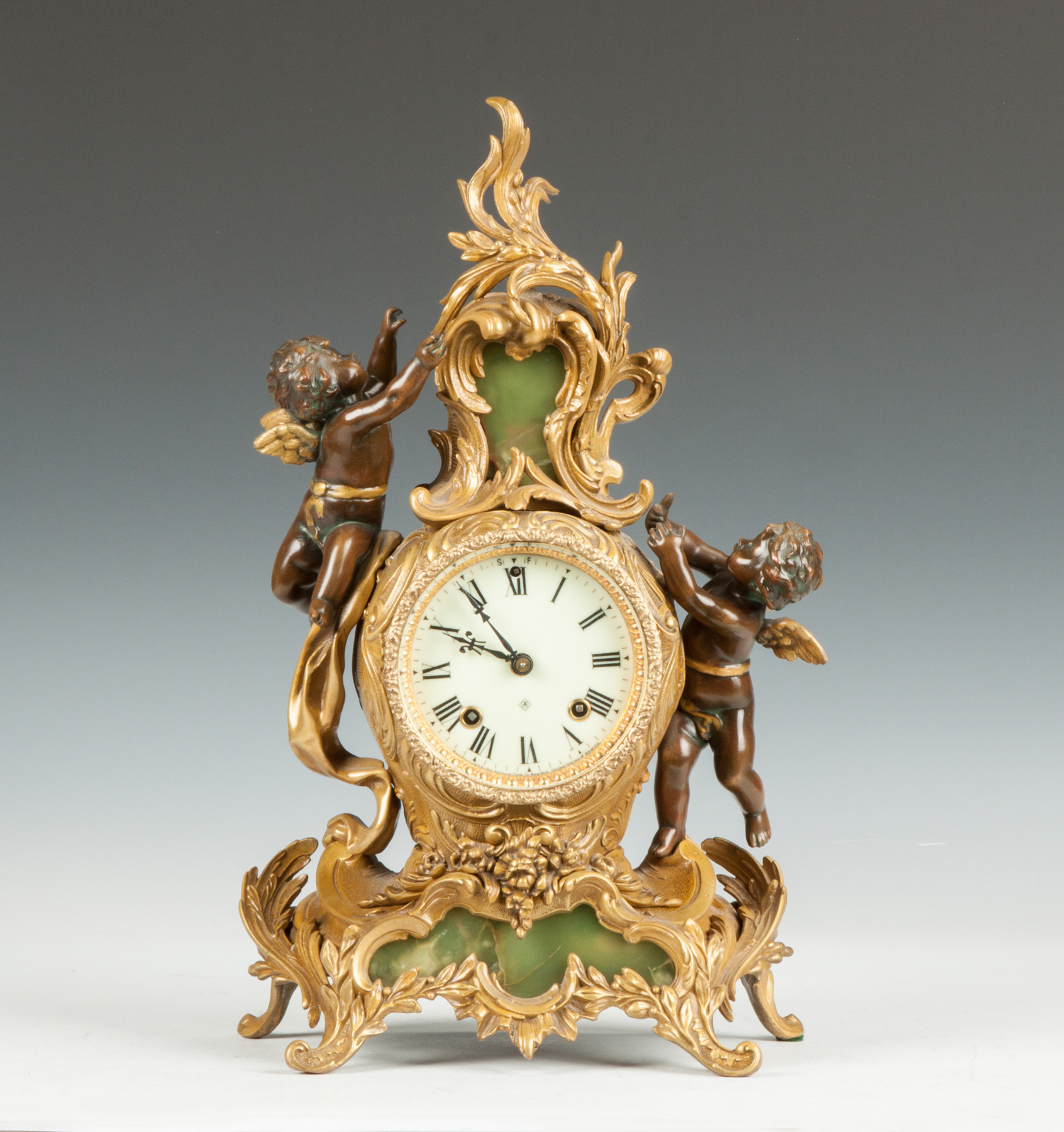 Appraisal: Ansonia Gilded Metal Onyx Shelf Clock with Cherubs th cent