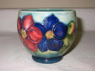 Appraisal: A MOORCROFT POTTERY VASE of squat ovoid form tube lined