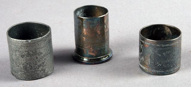 Appraisal: USS Maine napkin rings and USS Maine tooth pick holder