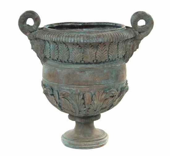 Appraisal: A Patinated Bronze Jardiniere of circular form with opposing satyr