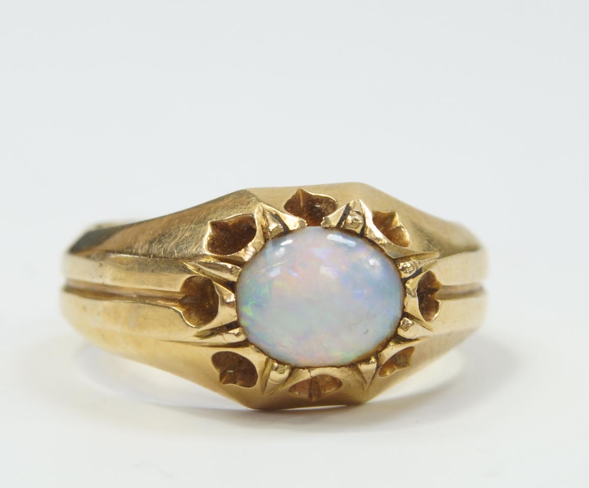 Appraisal: A gentleman's signet ring set with an opal marked C